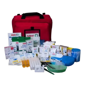 an photo of the 101483 trauma first aid kit. A nylon backed fabric bag is in the background and its contents have been emptied in the foreground. A resus mask, crepe bandage, saline solution, scissors, kidney dish and are seen.