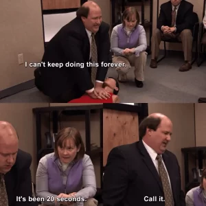 A man is exhausted giving CPR in a humorous scene from television's "the office"