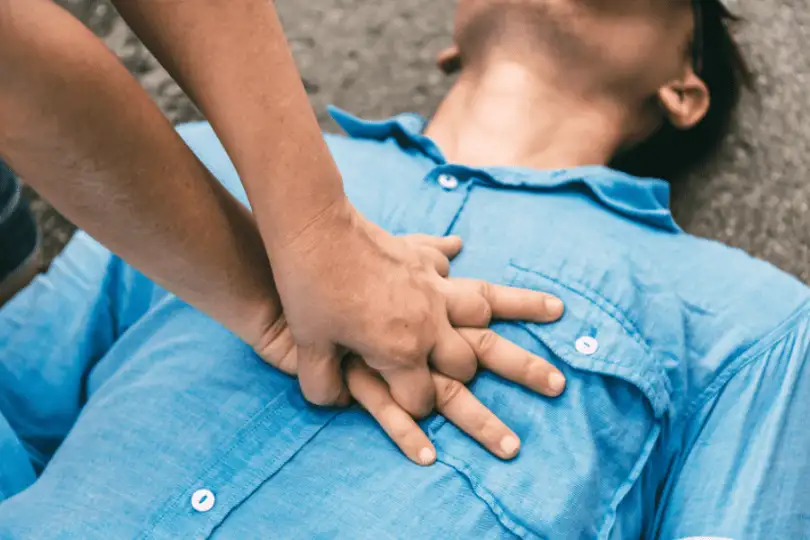 CPR is performed on a car crash victim