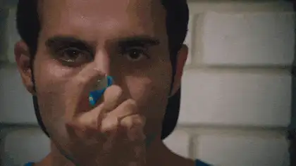 a man takes an asthma puffer dramatically