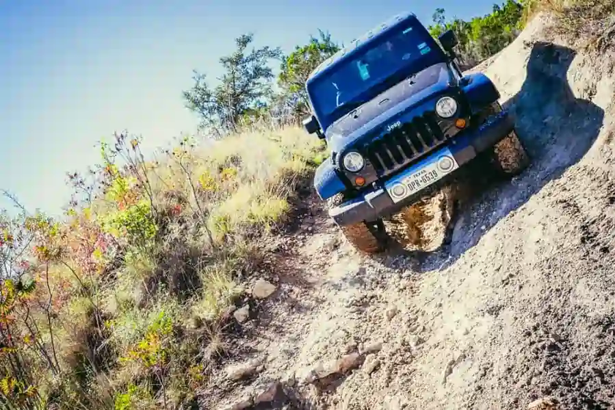 a jeep 4x4 on gravel road