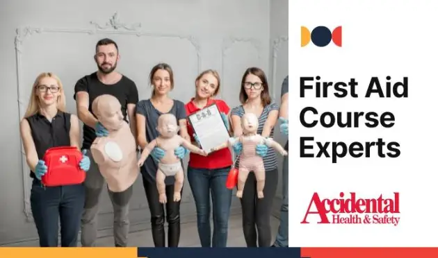 a group of happy people posing for a photo at a first aid course