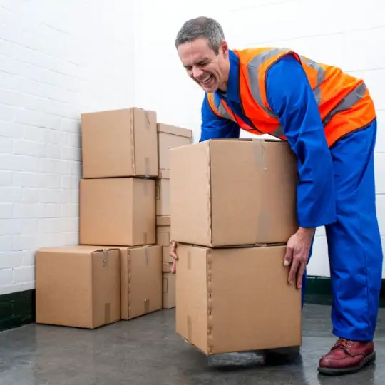 a man injures himself lifting boxes