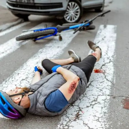 a biker is injured on a busy street