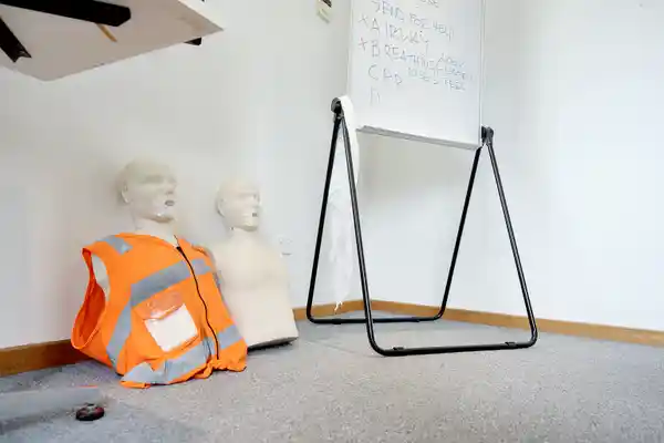 first aid manakins and whiteboard